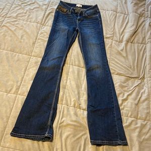 Women’s Size 27W 36L Shyanne Jeans with aztec details on pockets.
